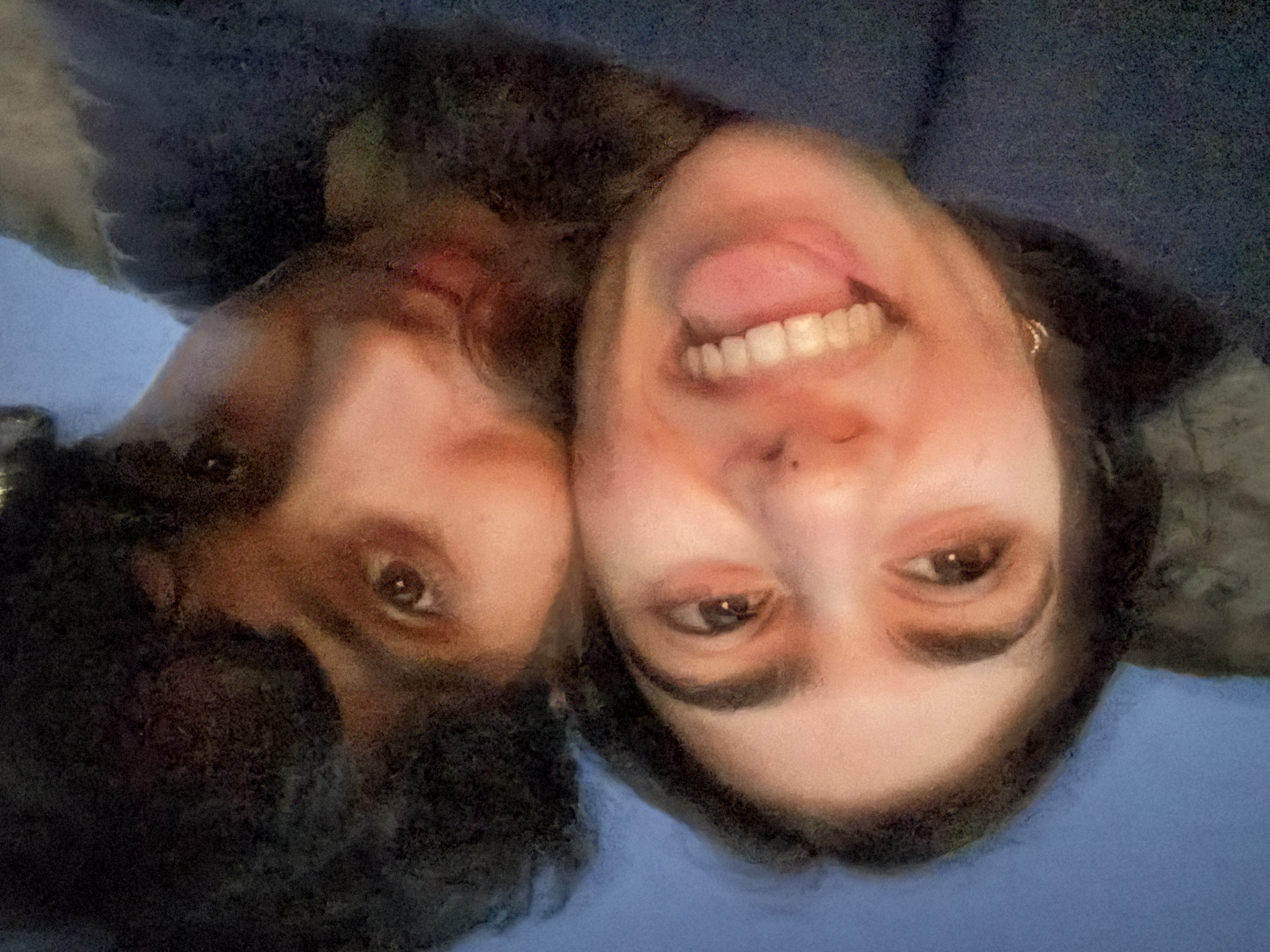 saba and her boyfriend smiling and hugging at the beach in a close-up selfie