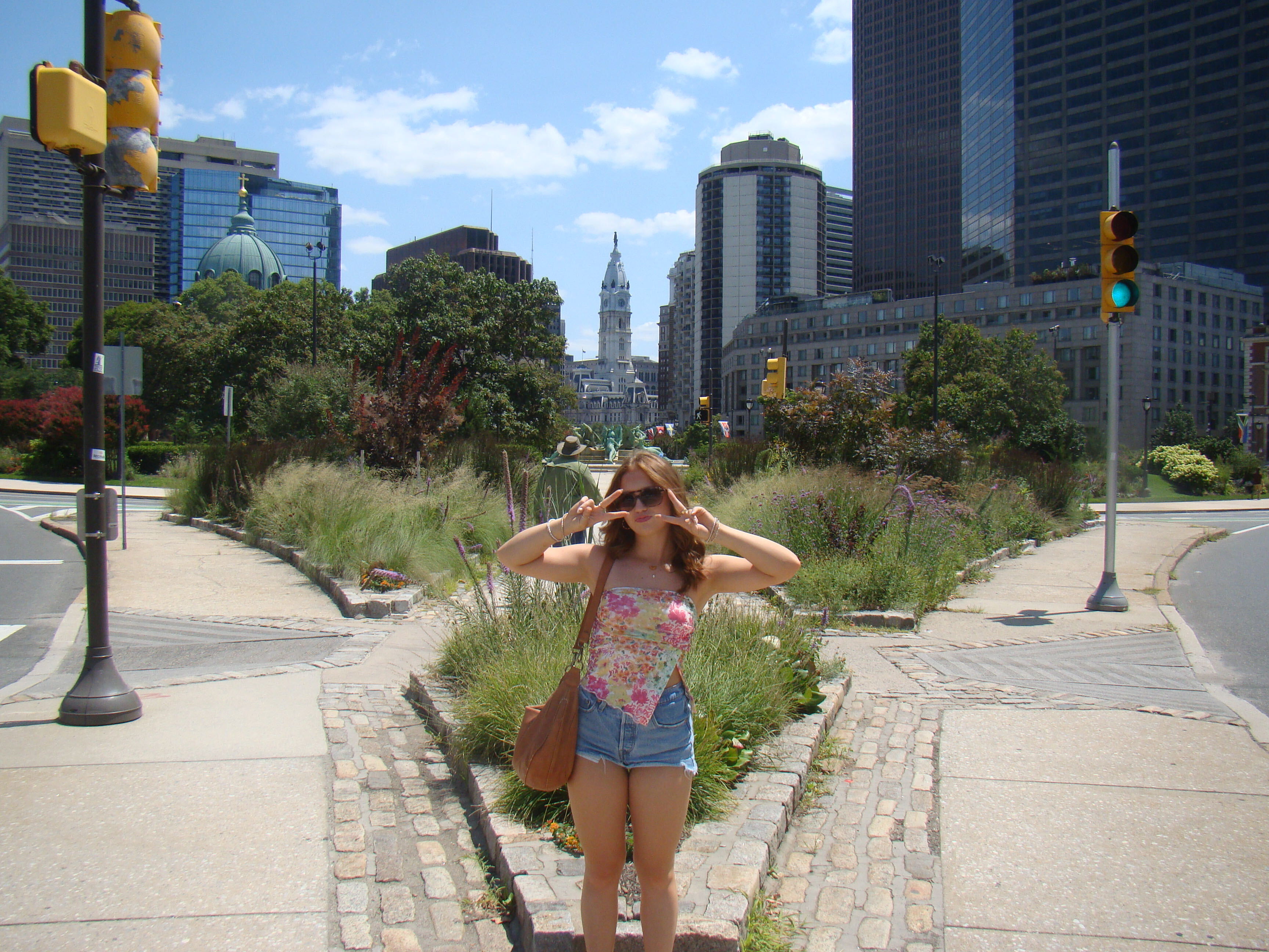 photo of a woman in front of scenery