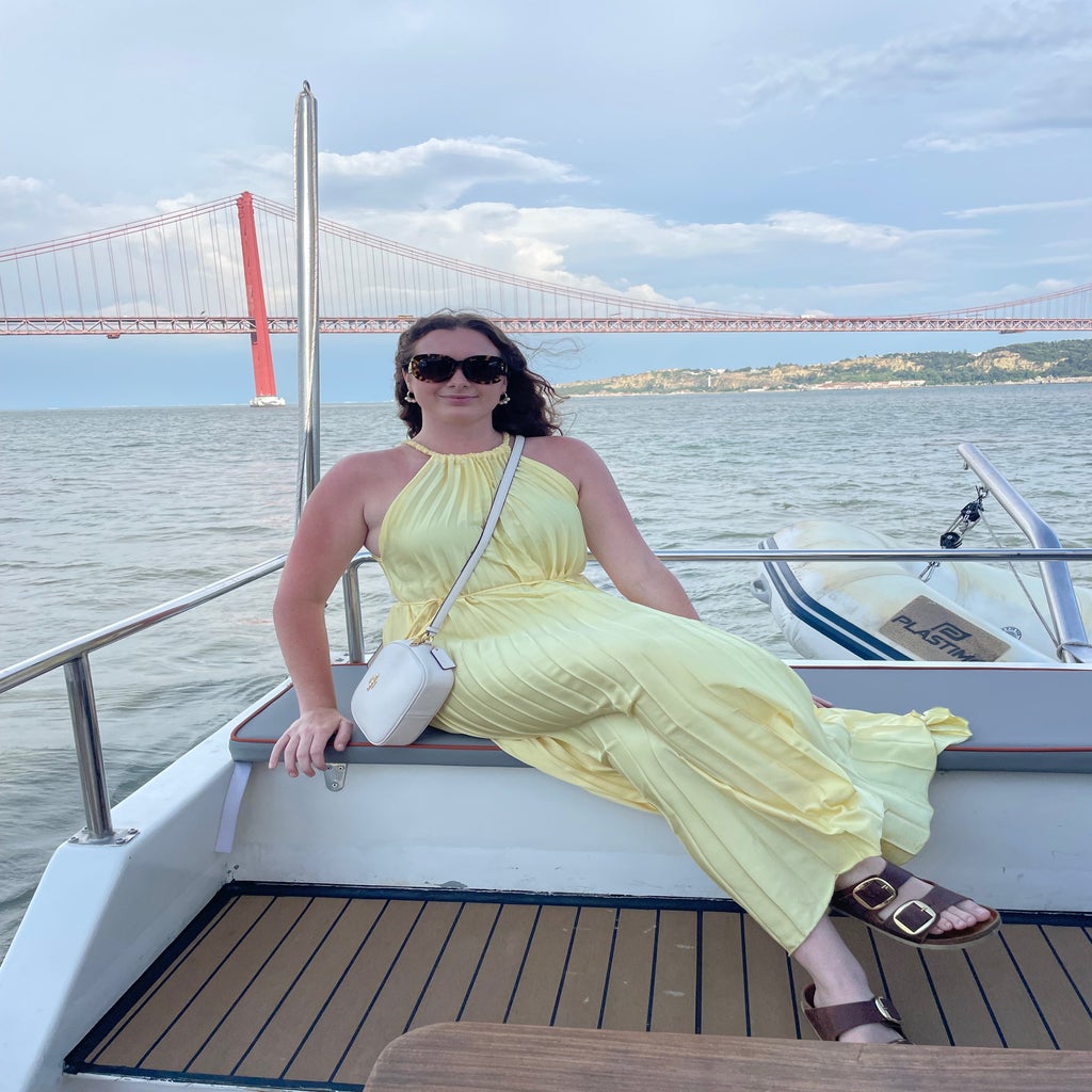 woman sitting on a boat on the River Tagus