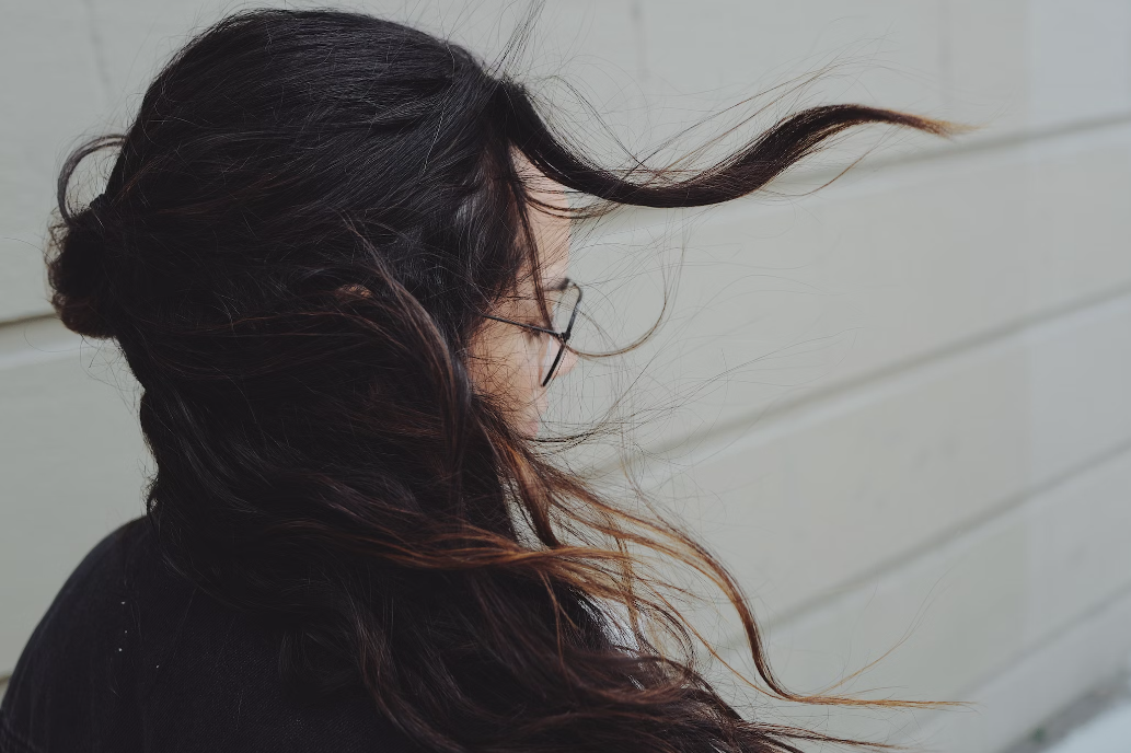 girl with hair blowing in the wind
