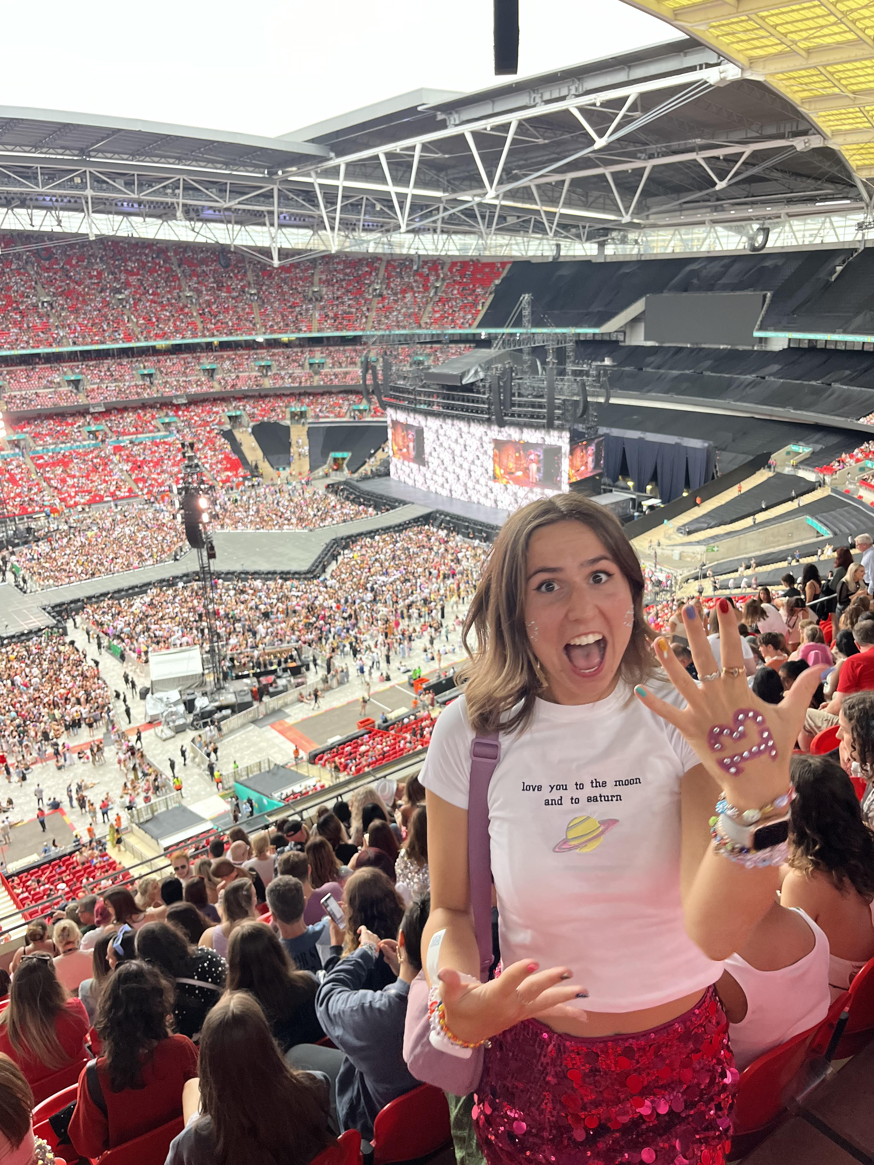 Poppy at the taylor swift concert excited in the arena