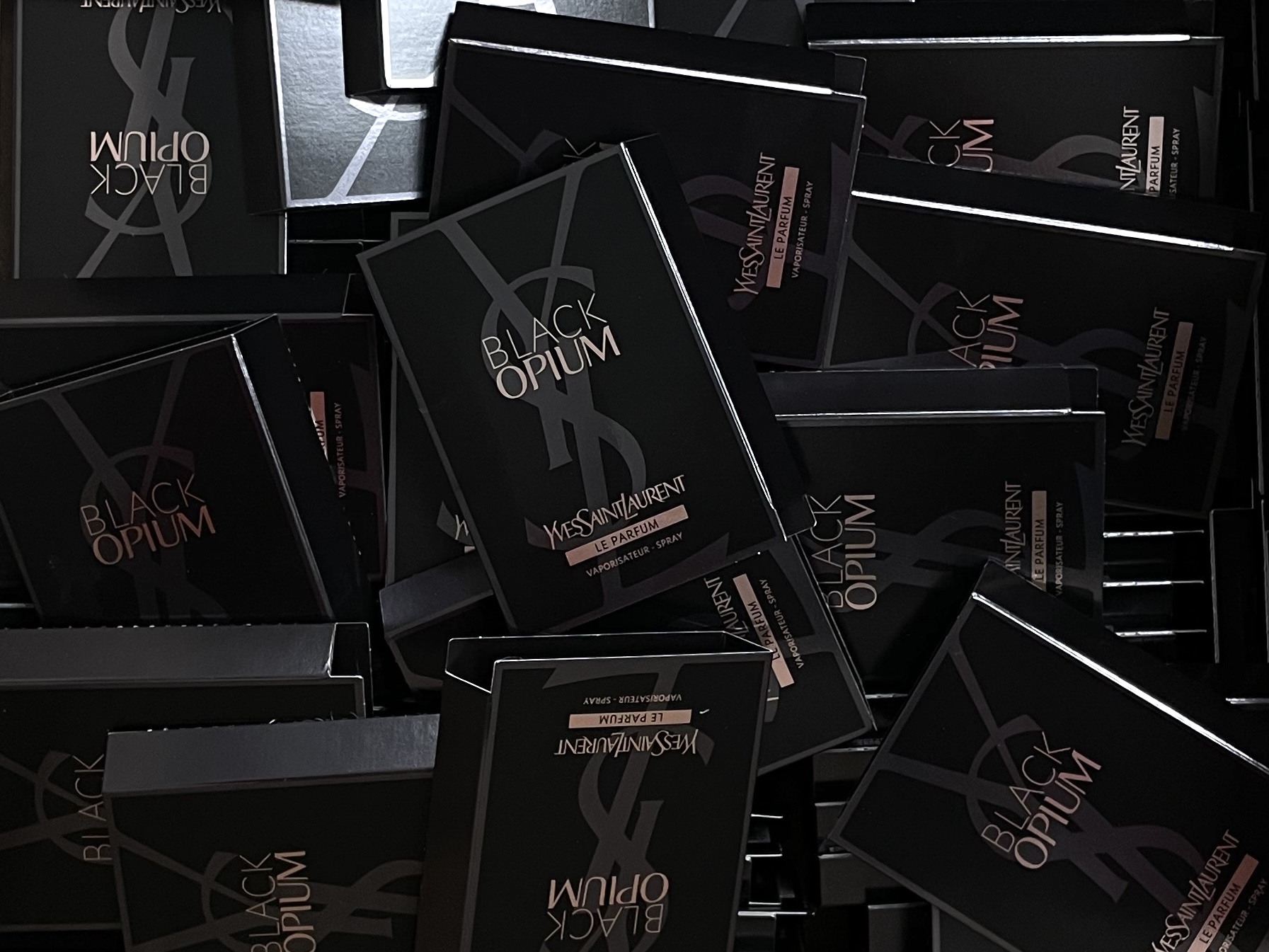 Photo of samples of Yves Saint Laurent\'s Black Opium perfume we received through a Her Campus partnership