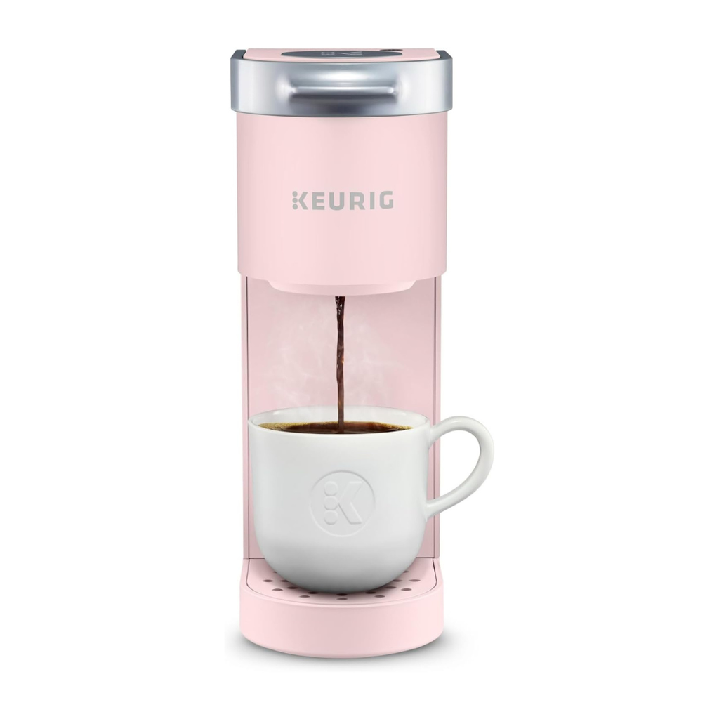 light pink single-serve coffee machine brewing coffee into a mug