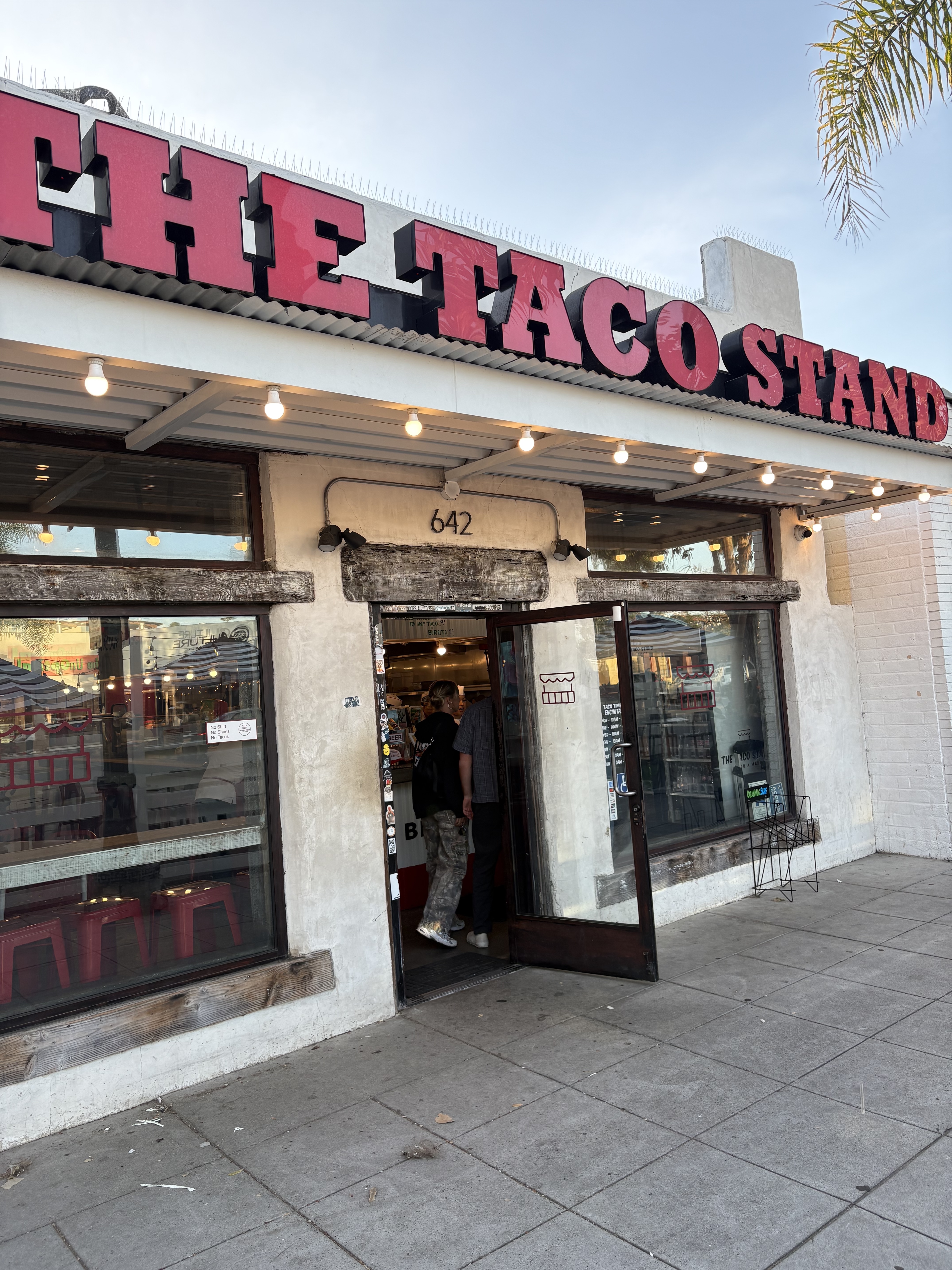Exterior of The Taco Stand restaurant in Encinitas, California, showing the storefront entrance and signage.