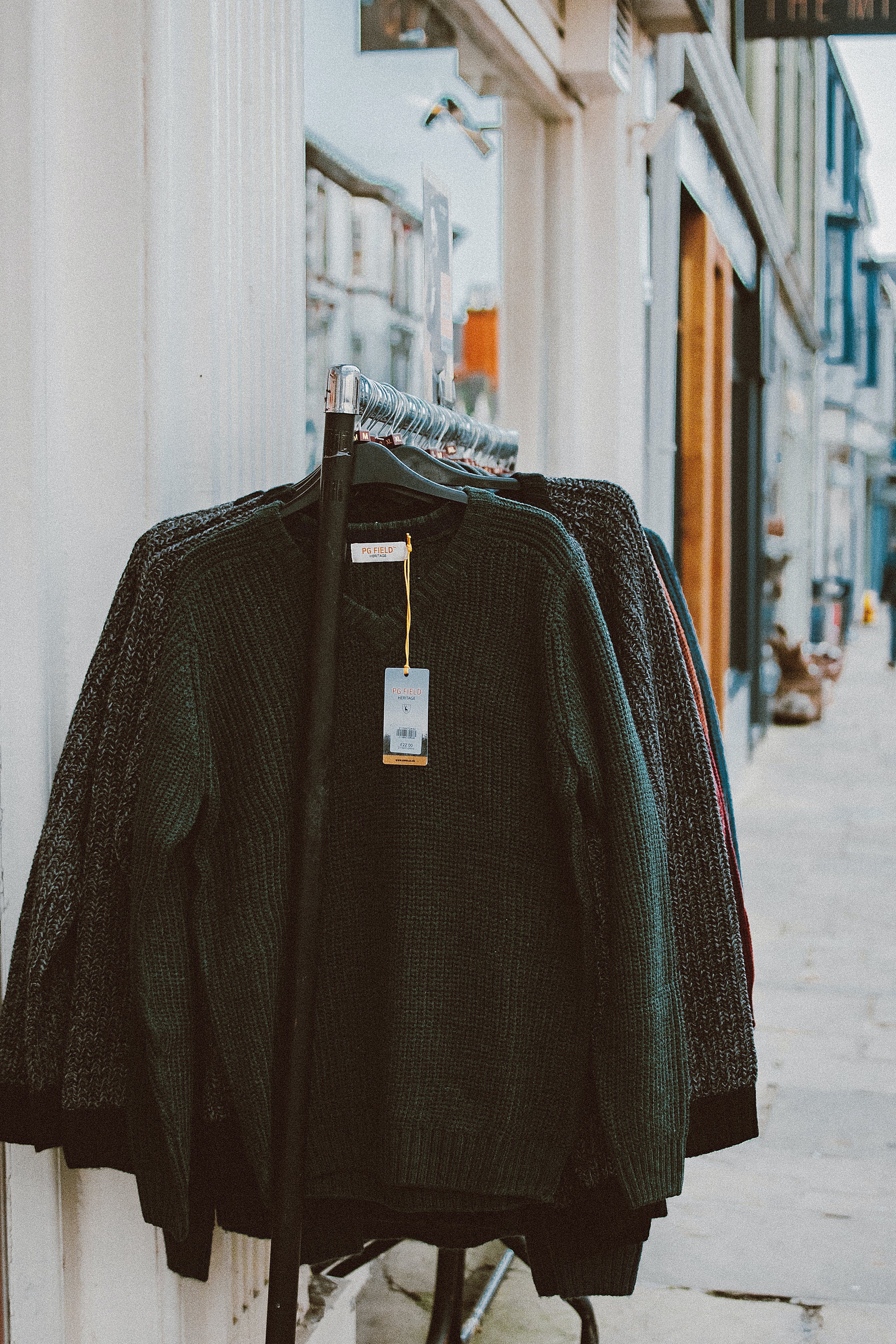 clothing rack of sweaters