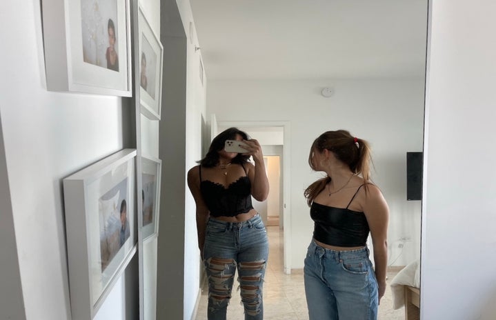 friends posing in mirror