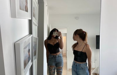 friends posing in mirror