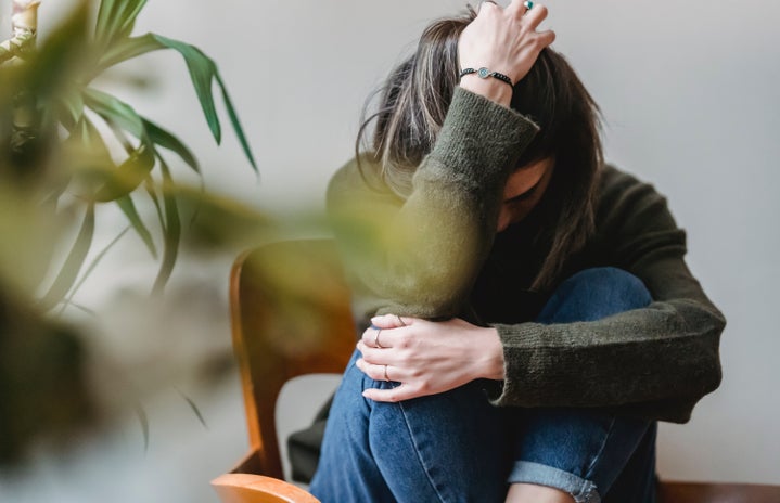 woman sitting on chair upset and frustrated