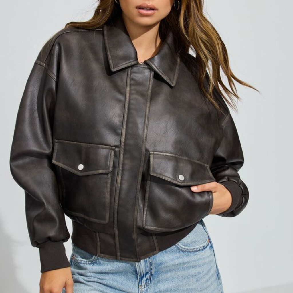 woman wearing a leather jacket and jeans