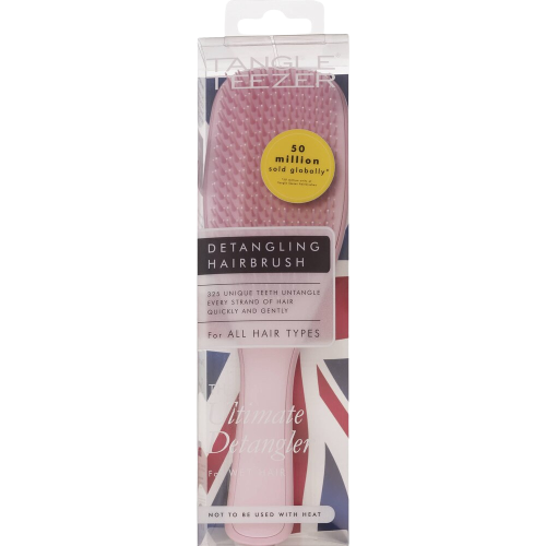 pink hairbrush in clear package