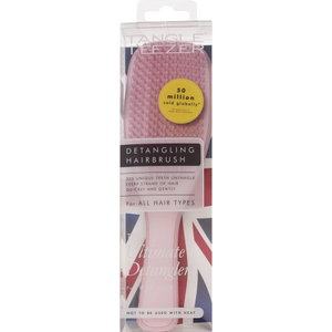 pink hairbrush in clear package