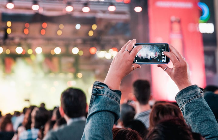 woman taking a picture on a show and festival