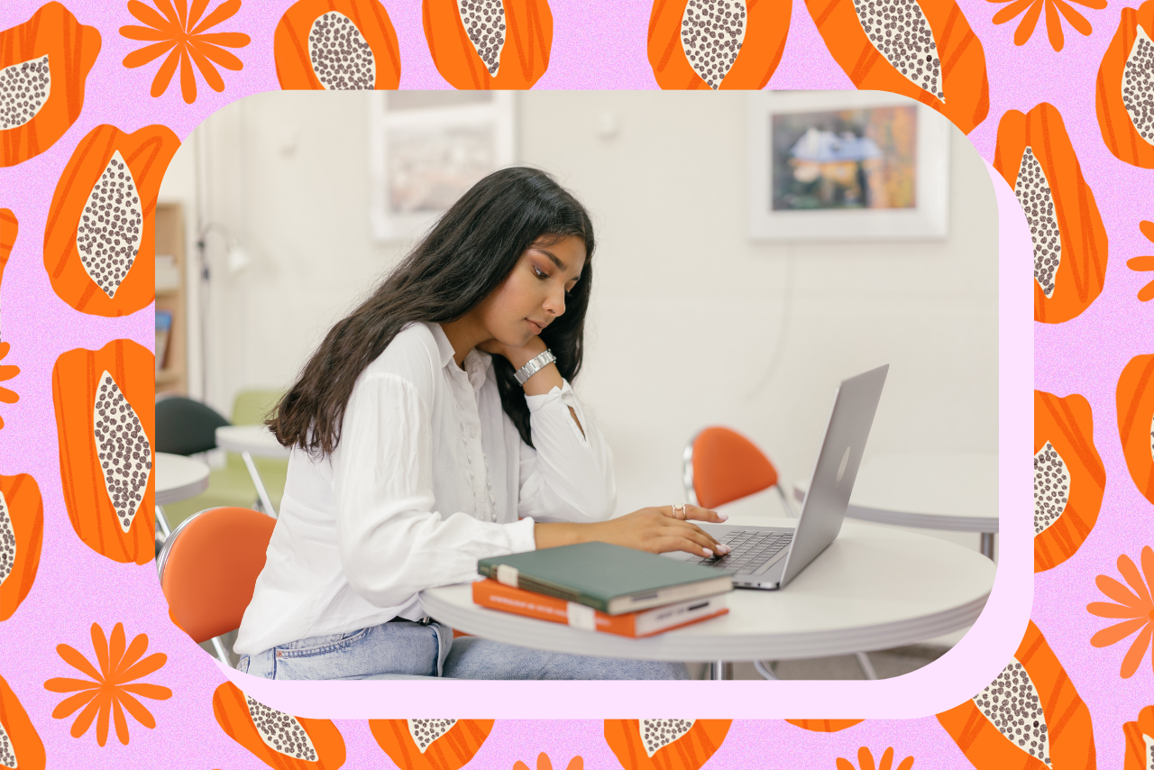 college student looking down sadly at her computer