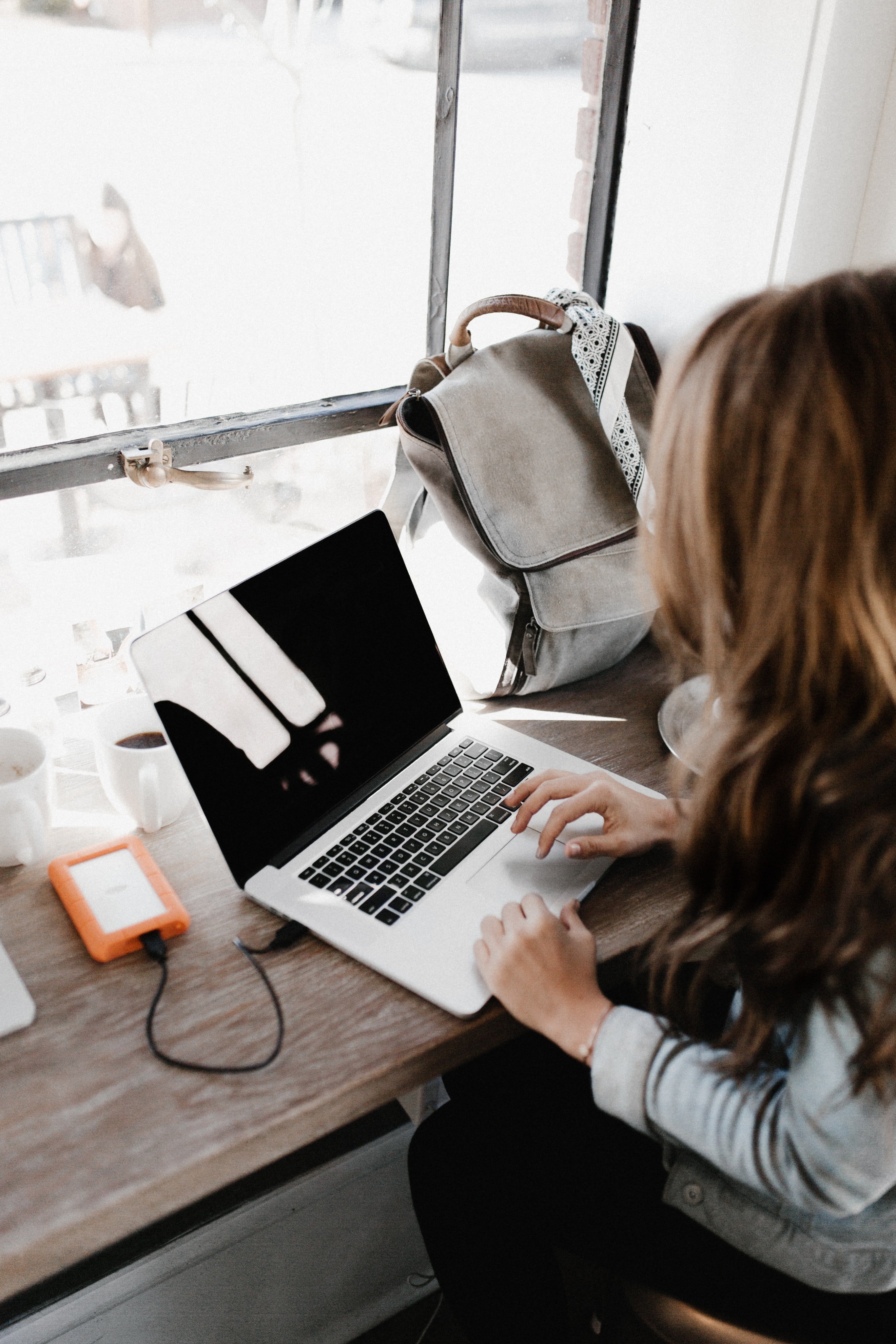 Woman using computer on table