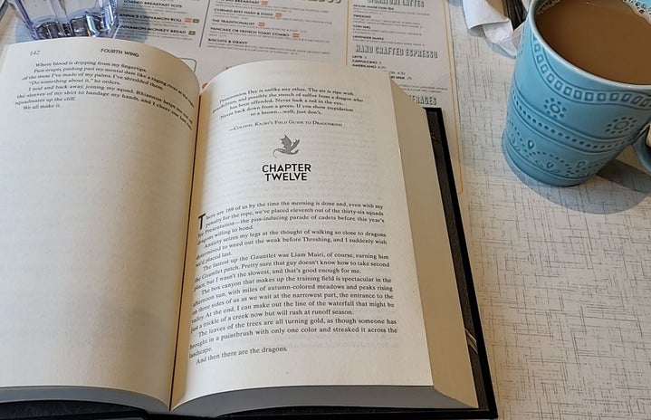 Photo of book described in article with a cup of coffee