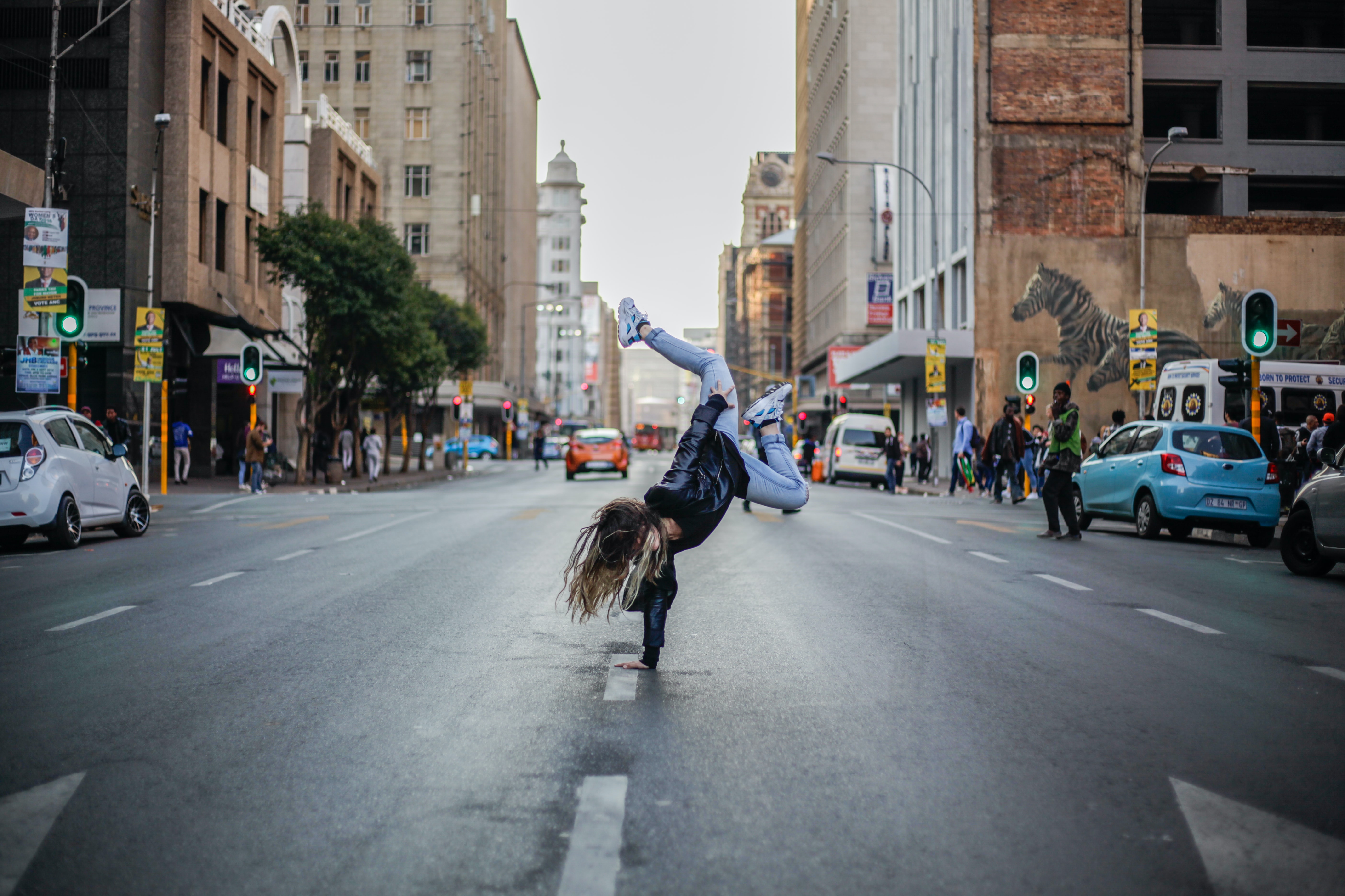 woman dancing in the middle of the street