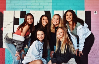 A group of girls representing the sisterhood of a sorority.