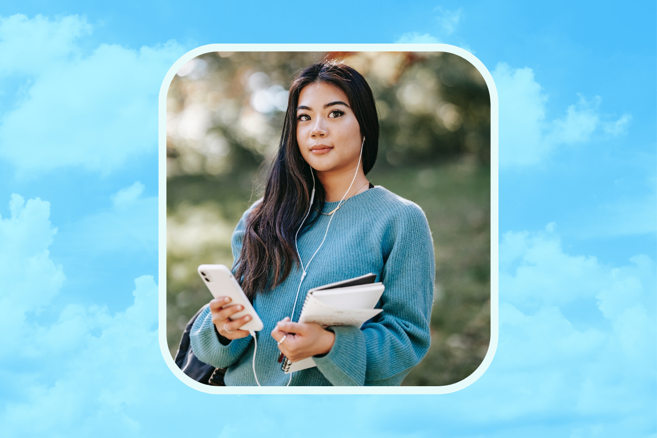 girl listening with headphones and holding books