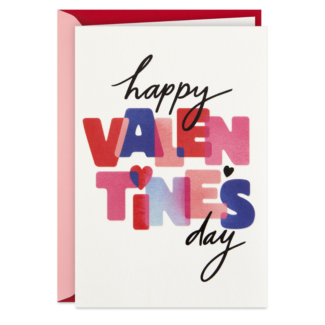 white valentine\'s day card with multi-colored lettering that reads \