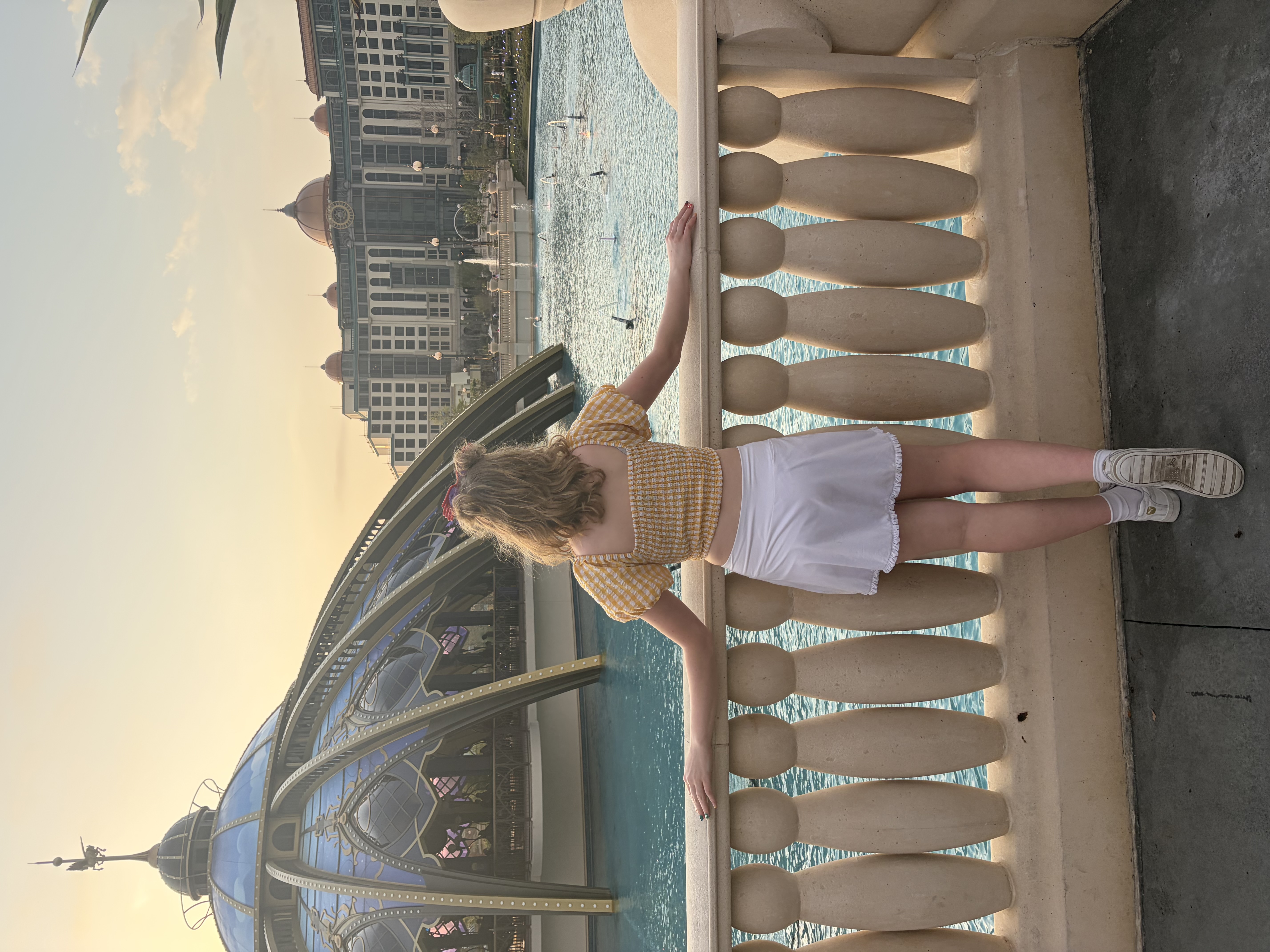Girl standing in front of water