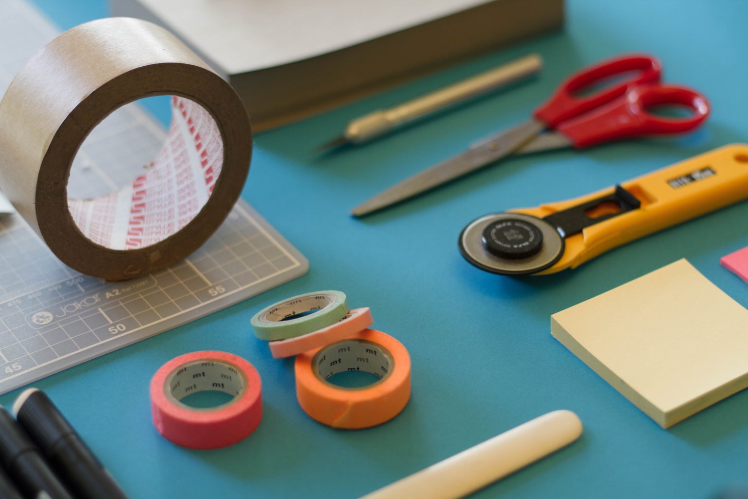 craft supplies on blue table