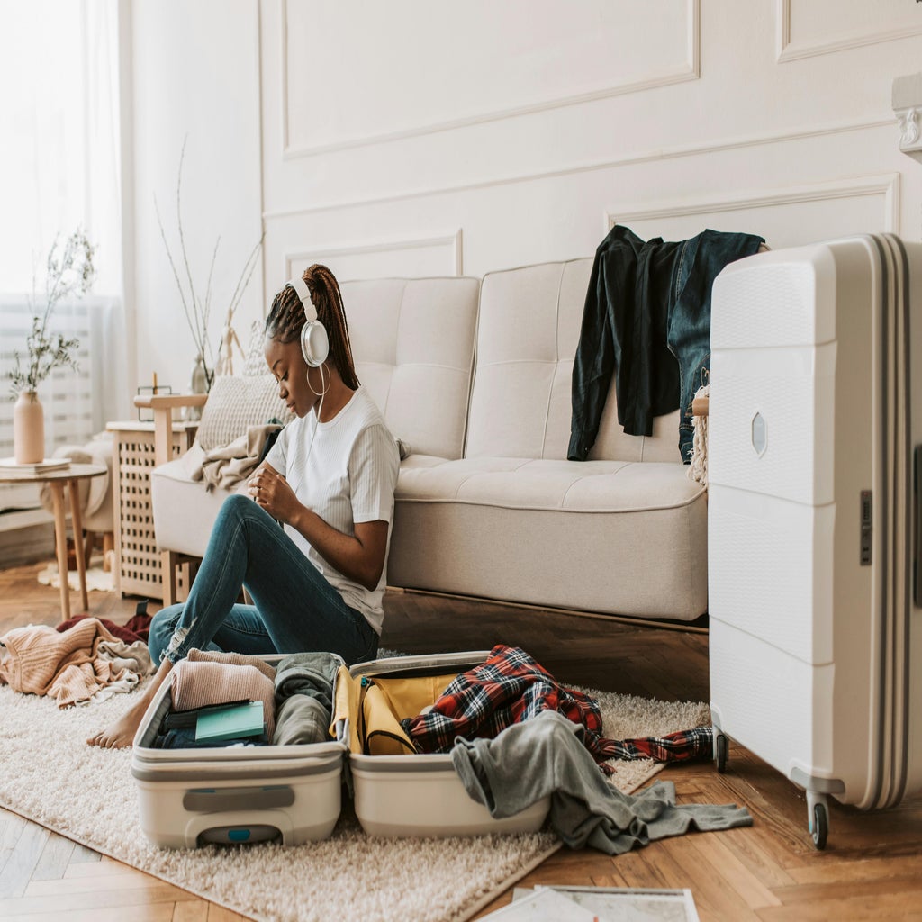 woman packing suitcase