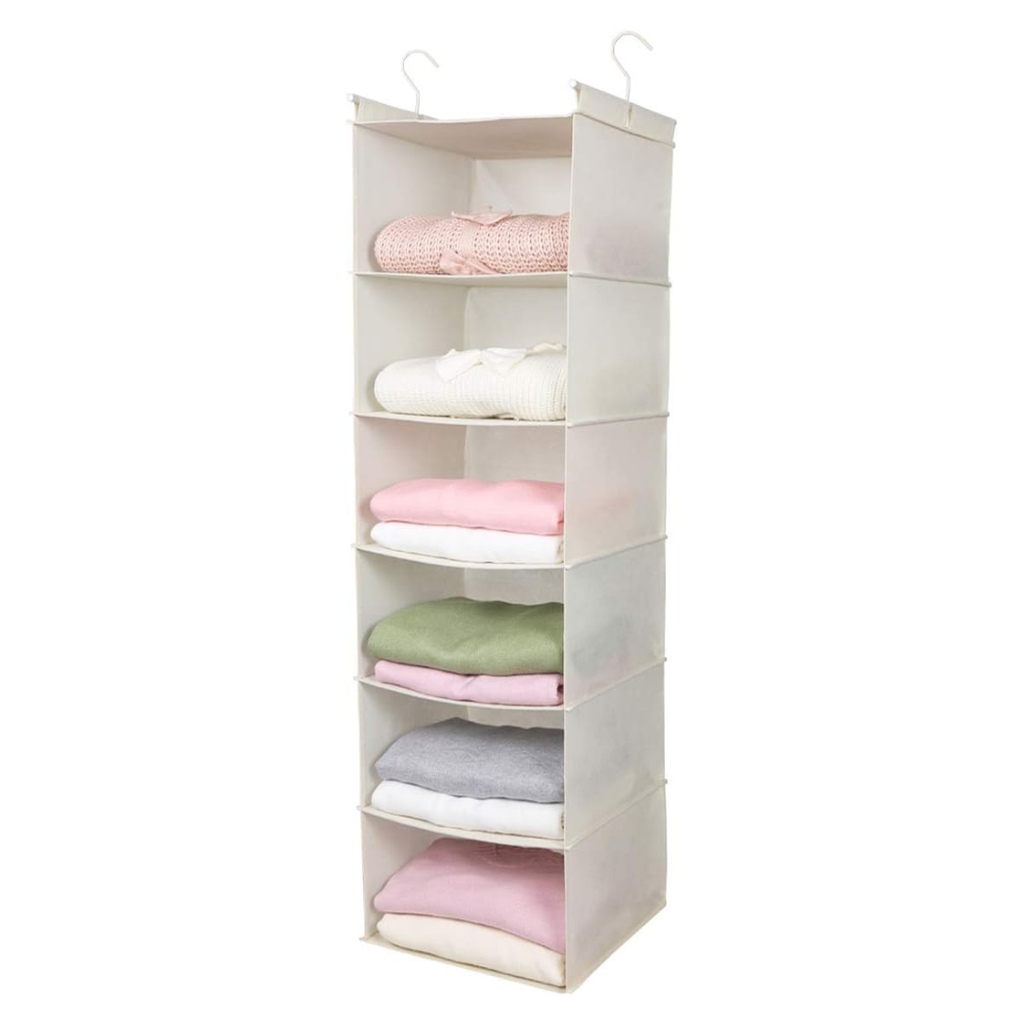 hanging closet organizer with folded clothes on each shelf