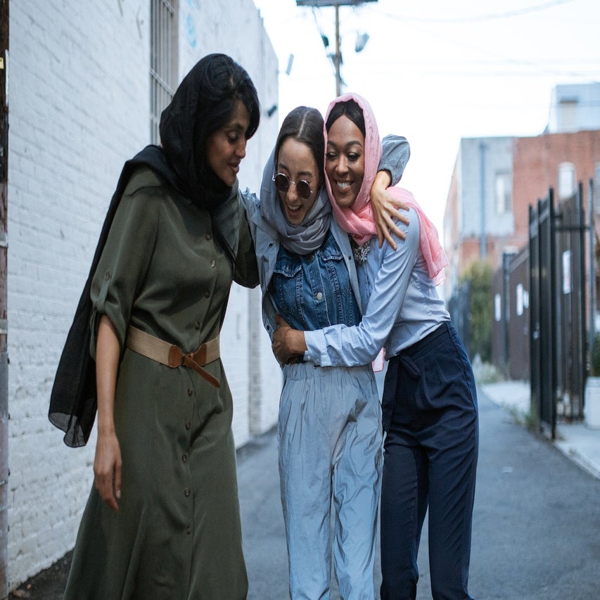muslim women walking and laughing together