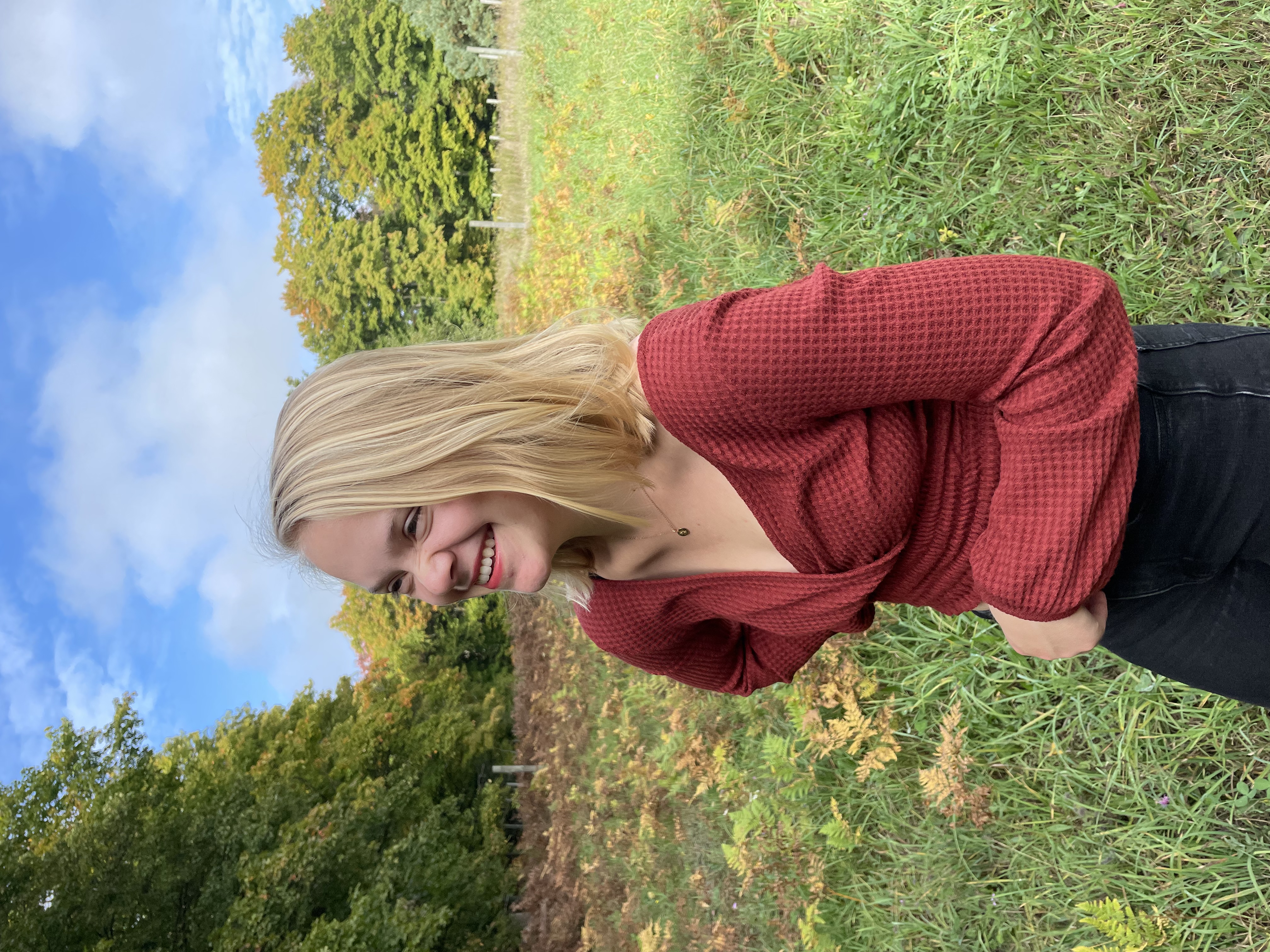 taylor manley, girl in a field, fall, trees, blonde girl, red shirt
