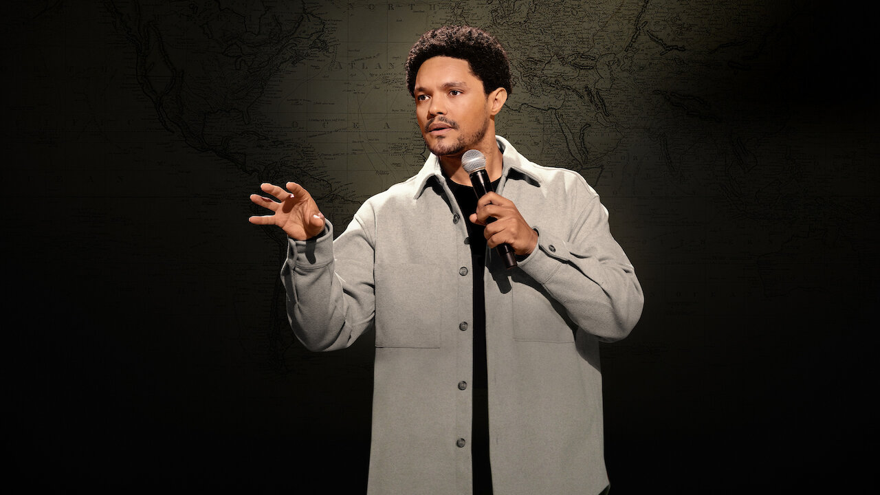 Trevor Noah using a microphone