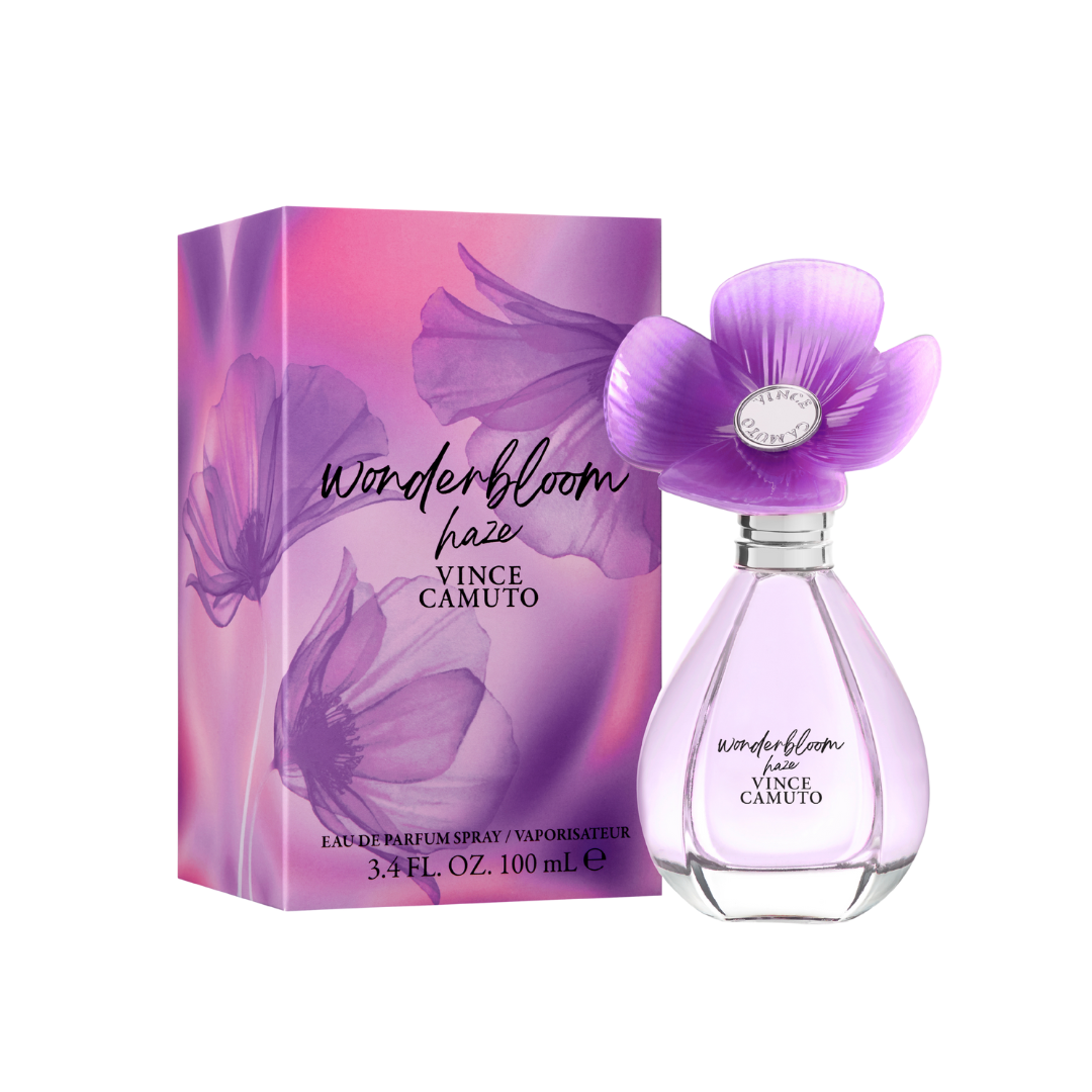 A bottle of Vince Camuto Wonderbloom Haze perfume with a purple flower-shaped cap, placed next to its matching pink and purple floral box.