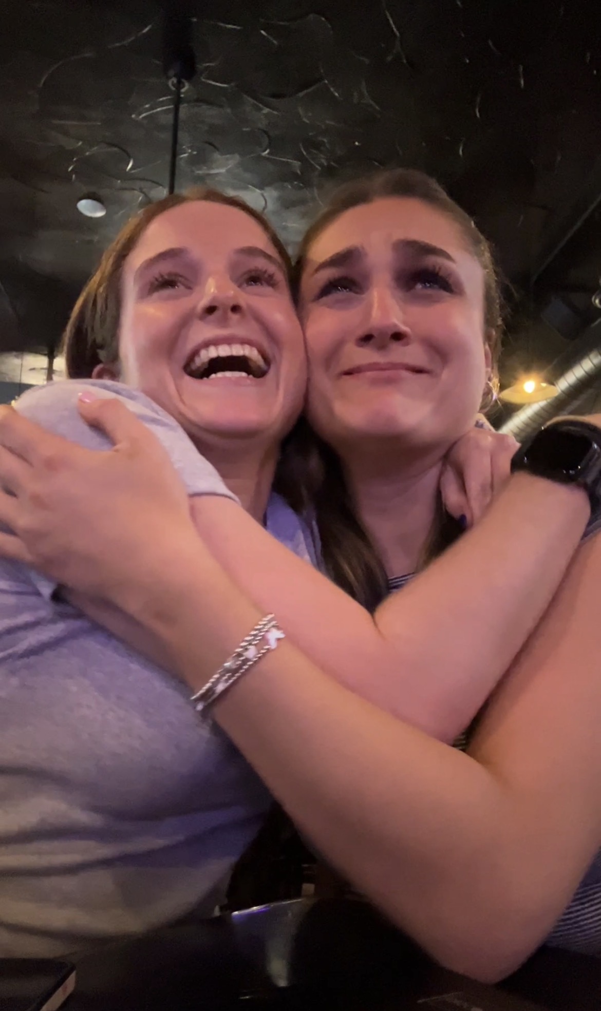 friends hugging one another