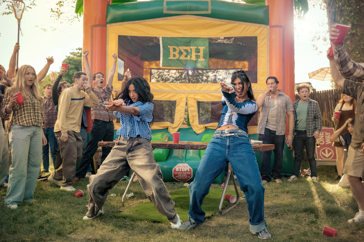 Two South Asian Women dancing in a college setting