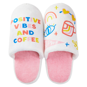 white and pink slippers with printed illustration and text that reads \