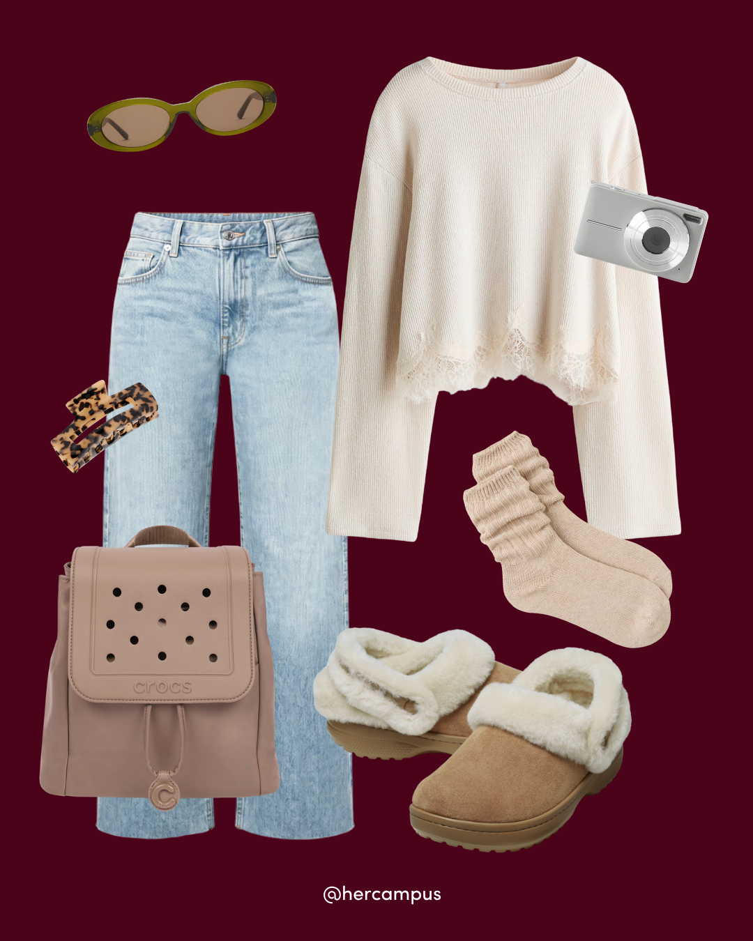 Flat lay of a cozy college outfit: cream sweater, light-wash jeans, tan clogs, socks, blush backpack, sunglasses, hair clips, and camera on burgundy.