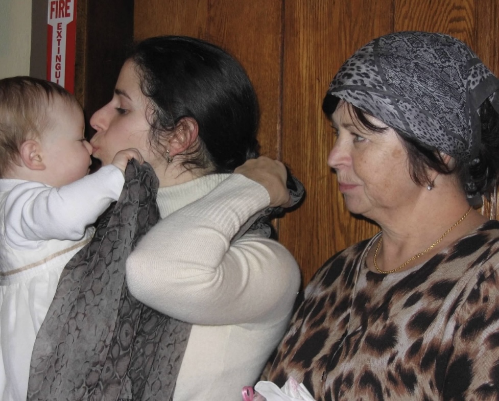 family at Russian Orthodox baptism