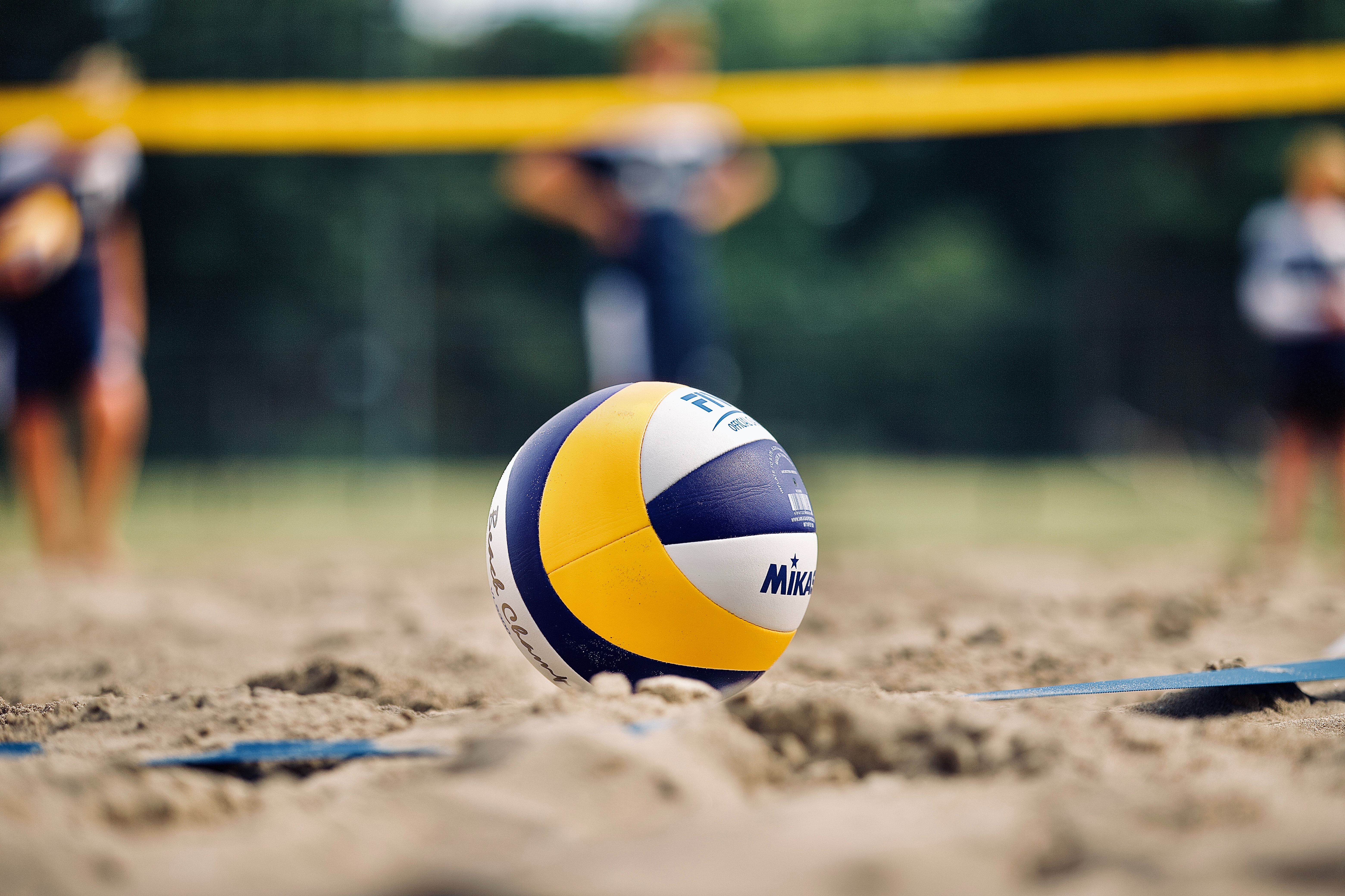 beach volleyball court by Unsplash?width=698&height=466&fit=crop&auto=webp&dpr=4