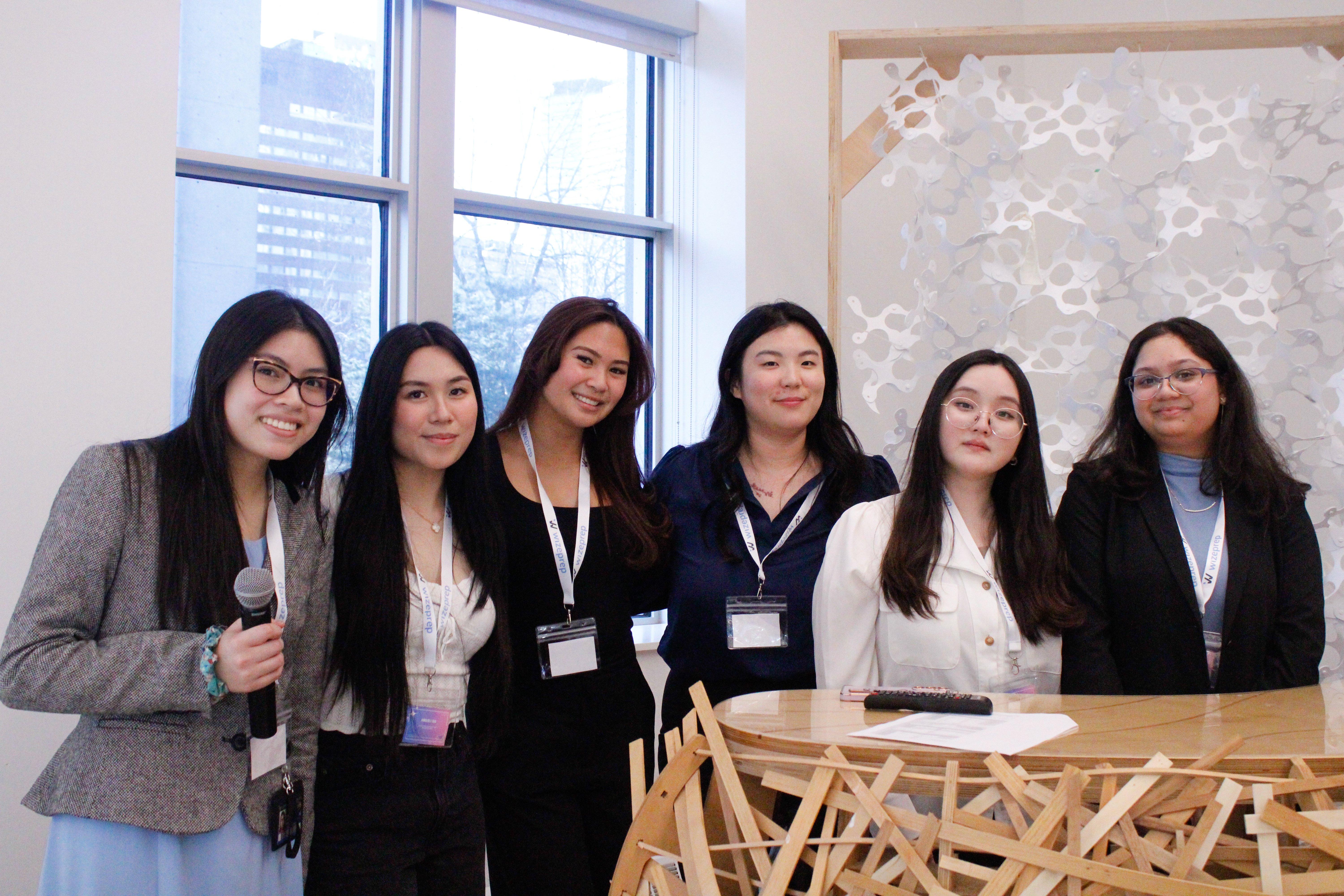 Executive members of BOOSTHer smiling at the camera.