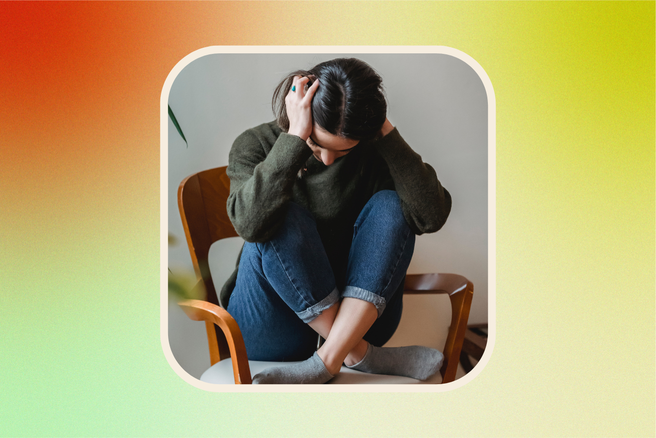 Woman sitting down stressed.