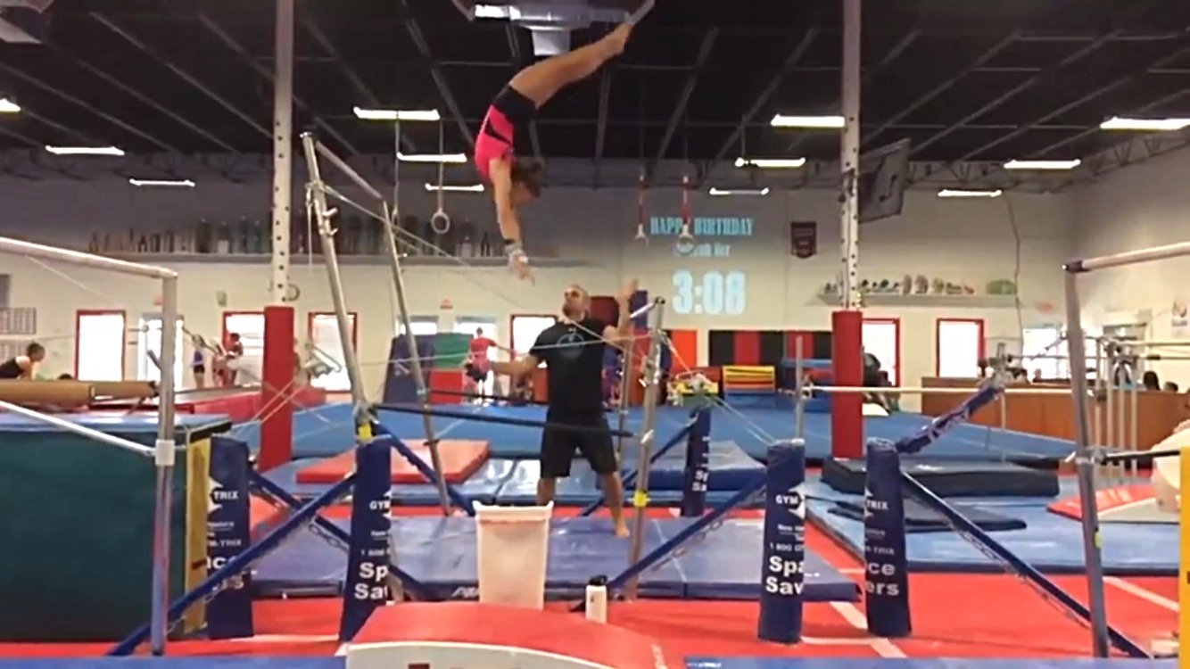 pink leotard on bars