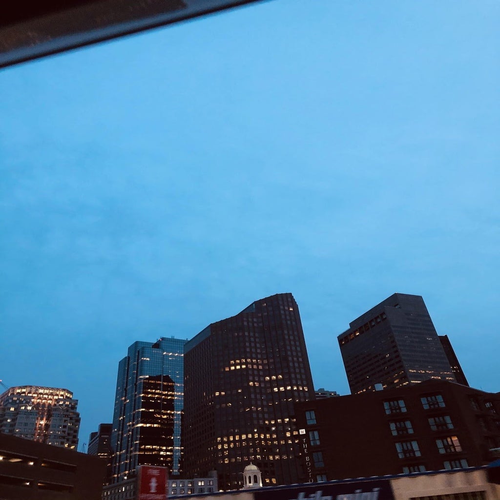 view of Boston at night from coffee shop