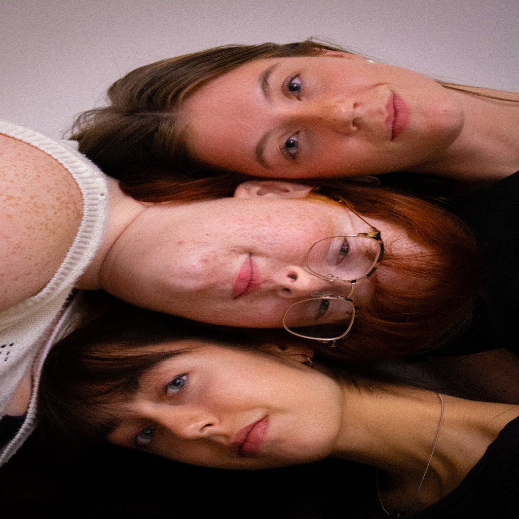 Three women with heads stacked