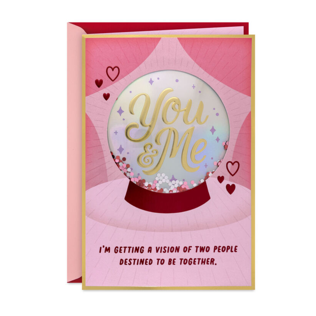 Greeting card with a pink and red design. A crystal ball with \