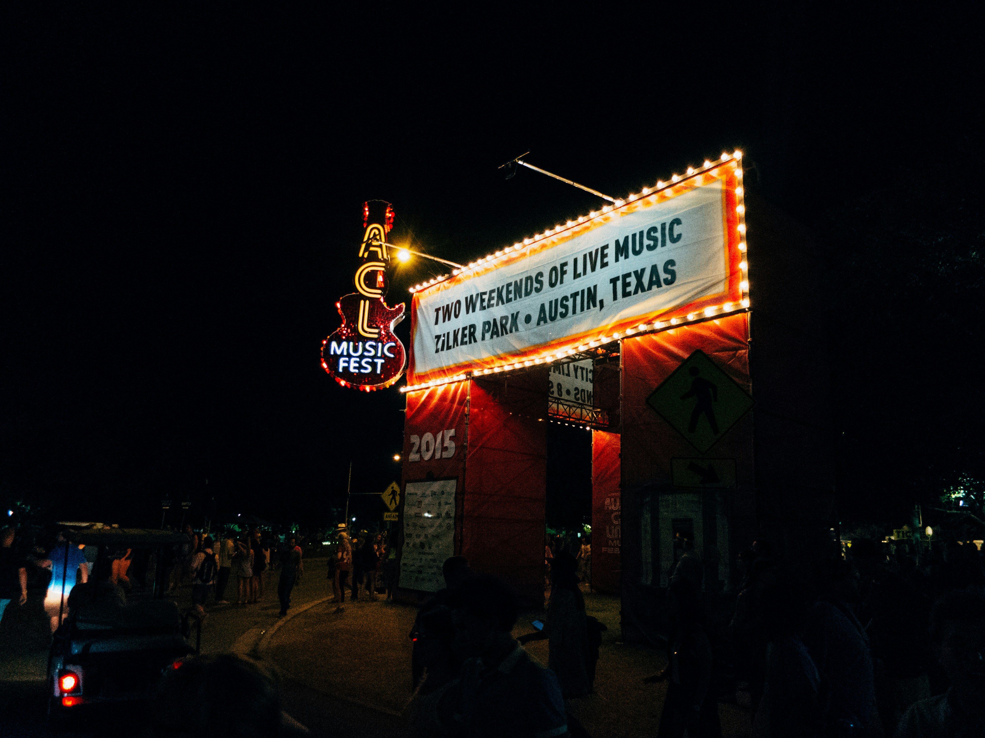 ACL sign with people walking around it