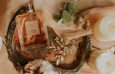 Perfume bottle on a tray with accessories