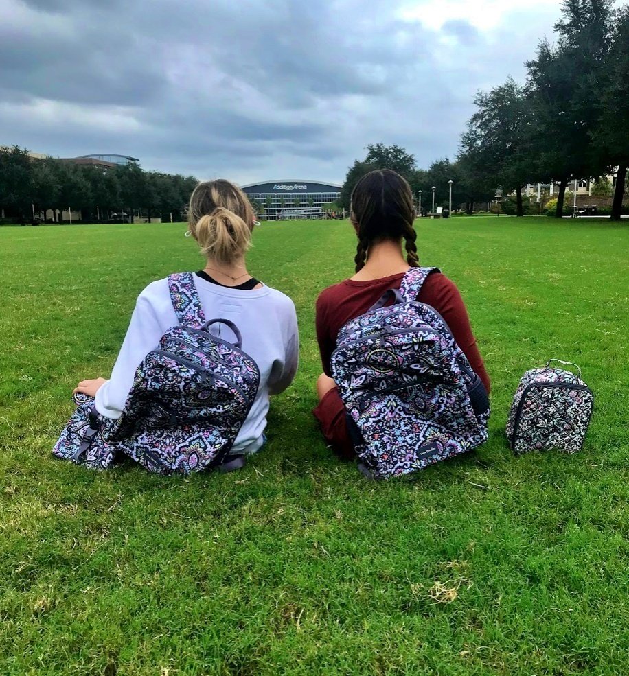 Students sitting on grass