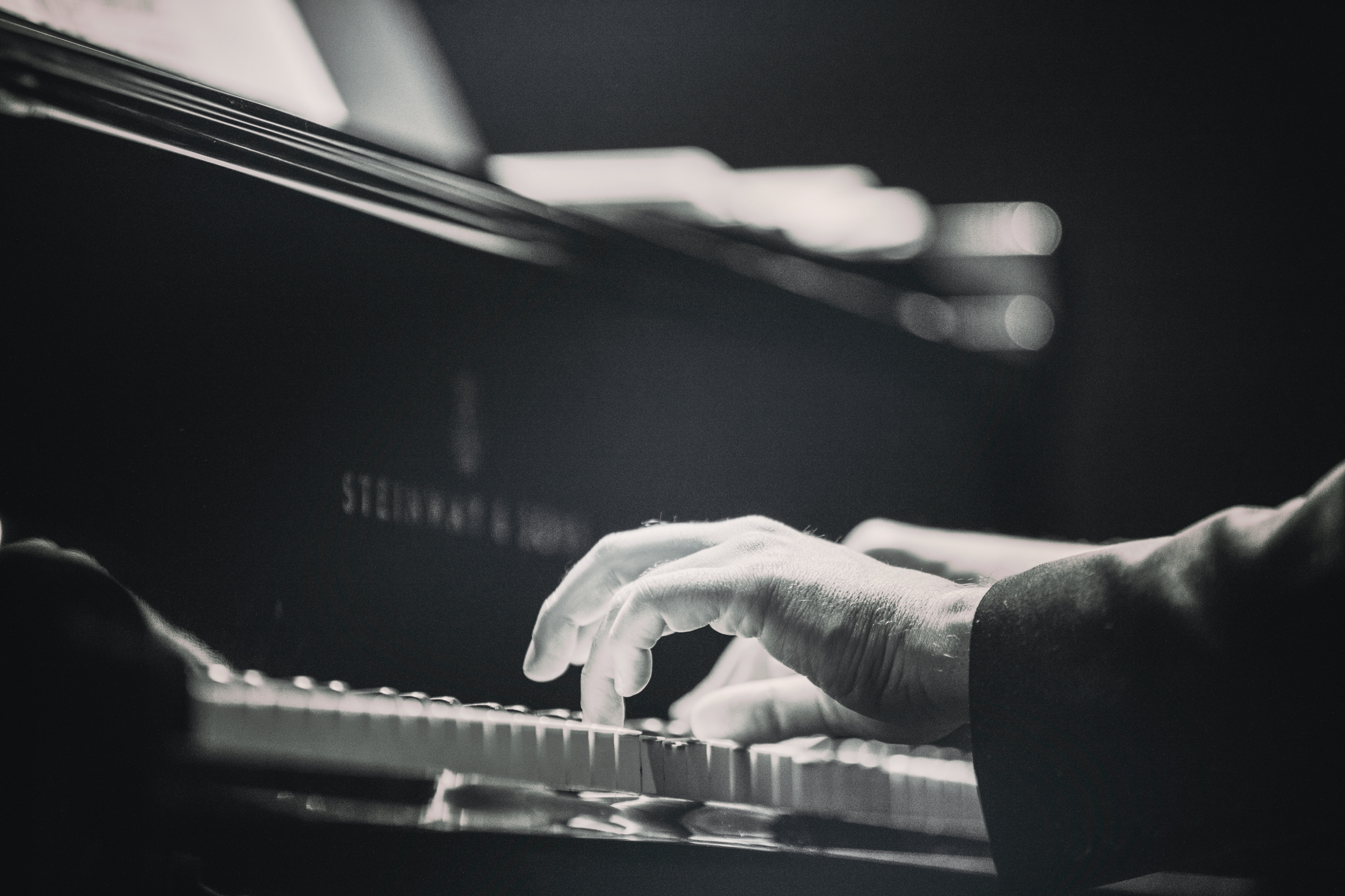 Hands Playing the Piano