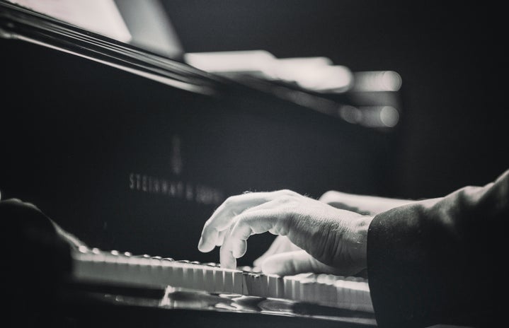 Hands Playing the Piano