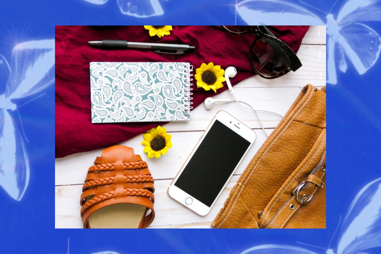 flatlay of items in purse