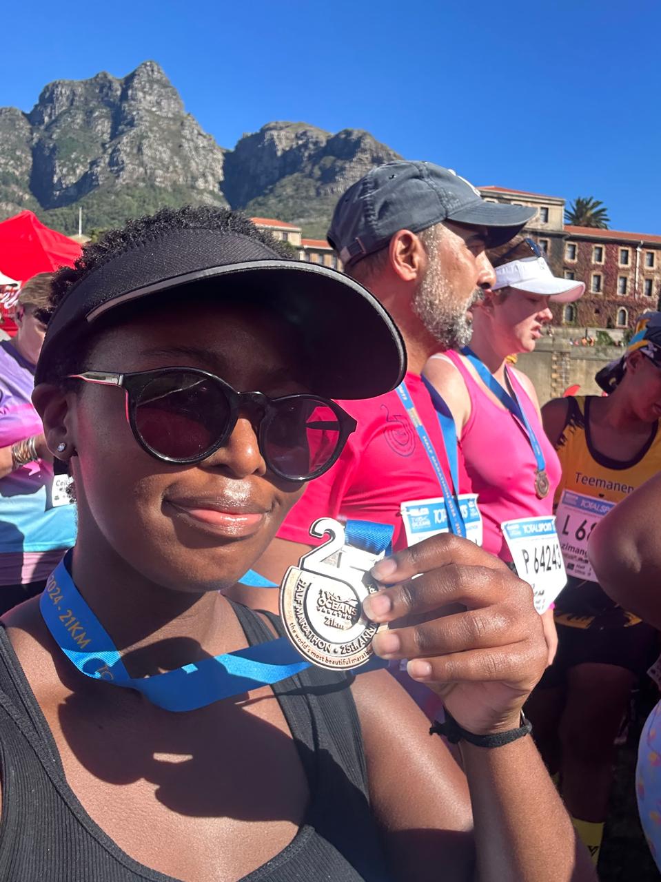 Woman with medal after marathon